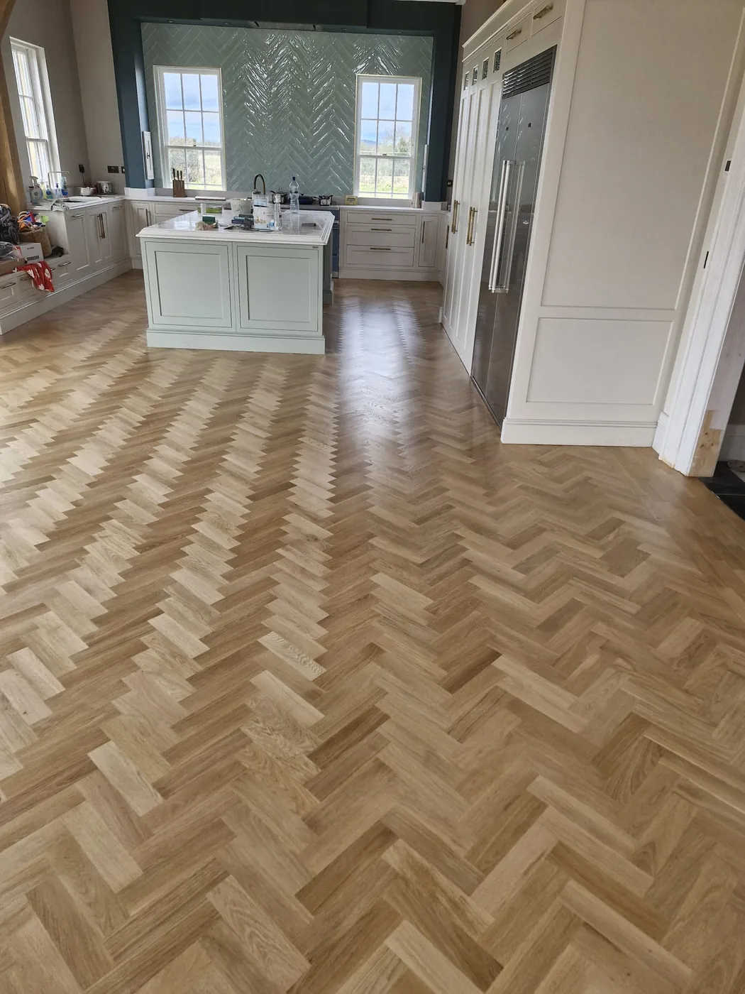 The same hallway finished with herringbone oak flooring